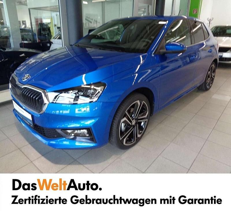 Mittelblau metallic Gebraucht 2022 Skoda Fabia Style Kleinwagen | € 27.900 - Bild 1/4