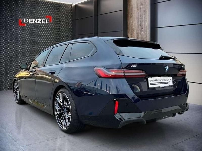 Gebraucht BMW i5 250 kW (340 PS) 2024 Tansanitblau ii meta Kombi