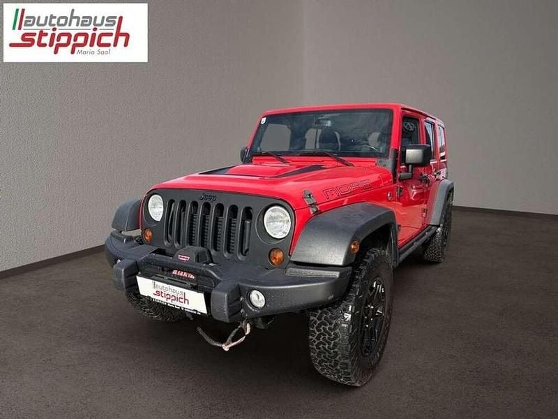 Rot Gebraucht 2013 Jeep Wrangler Unlimited Sahara SUV | € 35.890 - Bild 1/4