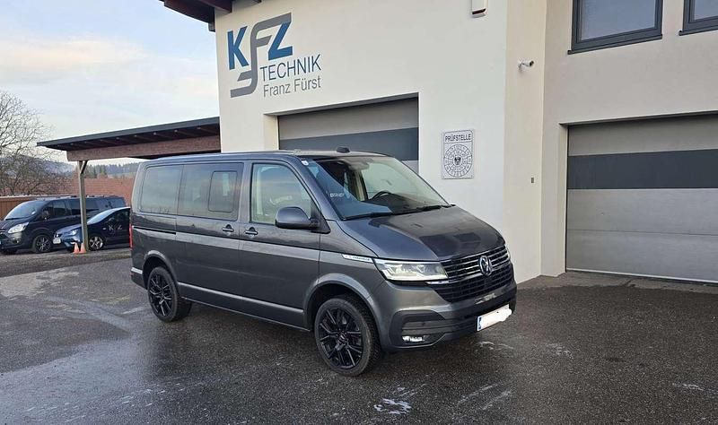 Grau Gebraucht 2024 VW Caravelle Comfortline Van / Kleinbus | € 69.990 - Bild 1/4
