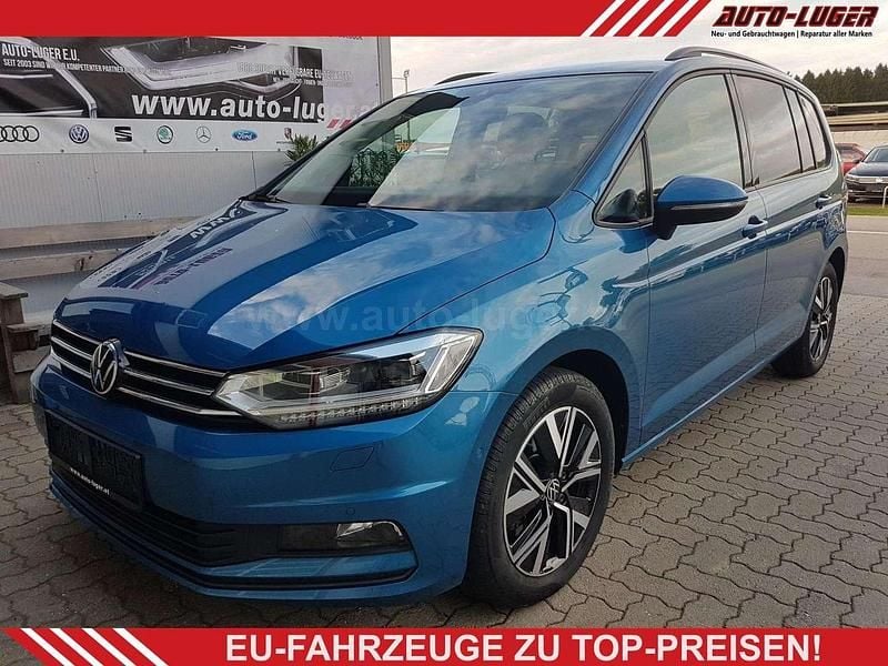 Caribbean blue metallic caribbean blue metallic Gebraucht 2022 VW Touran Comfortline Van / Kleinbus | € 27.300 (Fairer Preis) - Bild 1/4