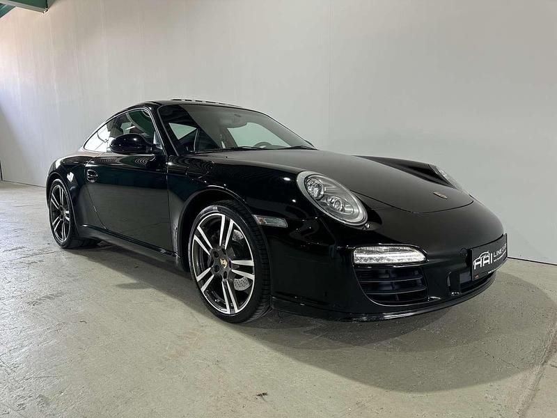 Schwarz Gebraucht 2010 Porsche 911 Carrera Sport Coupé | € 59.990 - Bild 1/4