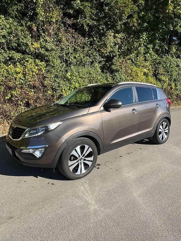 Braun Gebraucht 2012 Kia Sportage Active SUV | € 9.250 (Fairer Preis) - Bild 1/4