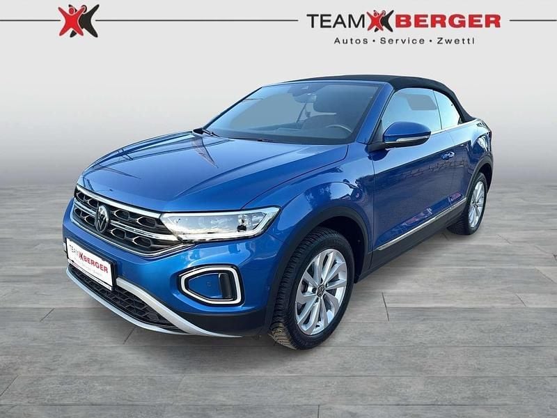 Mittelblau metallic Gebraucht 2024 VW T-Roc Cabriolet Style Cabrio | € 29.990 - Bild 1/4