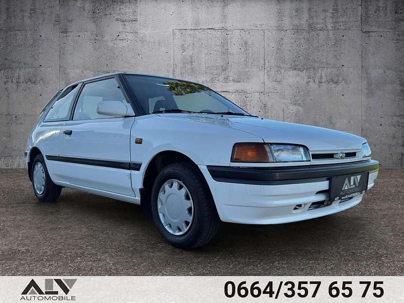 Weiß Gebraucht 1994 Mazda 323 Limousine | € 4.990 - Bild 1/4