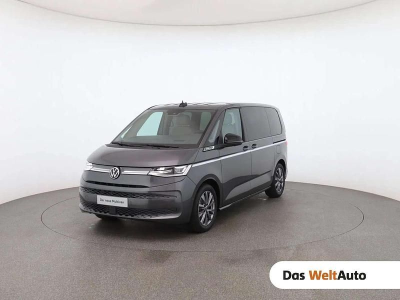 Mittelgrau metallic Gebraucht 2024 VW Multivan Style Van | € 68.490 (Teuer) - Bild 1/4