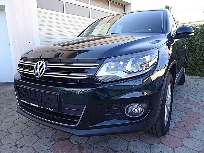 Grün Gebraucht 2014 VW Tiguan Sportline SUV | € 14.250 (Fairer Preis) - Bild 1/4