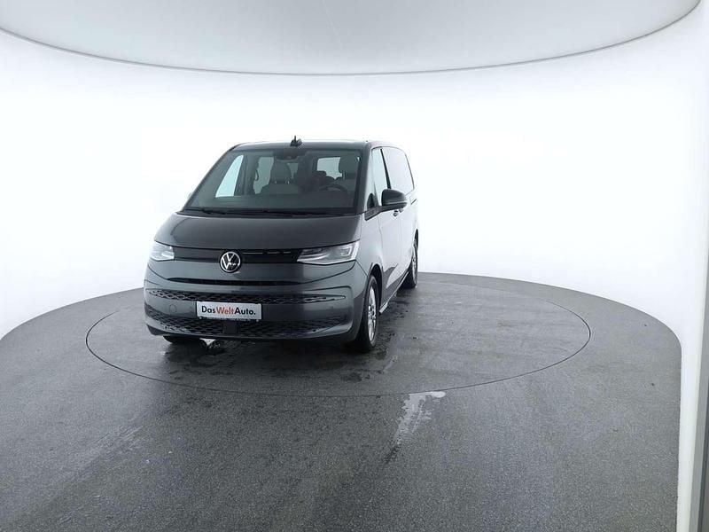 Mittelgrau metallic Gebraucht 2024 VW Multivan Business Van | € 53.950 (Superpreis) - Bild 1/4