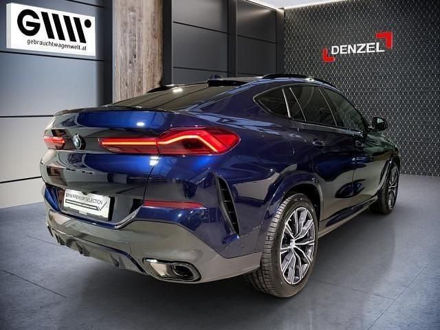 Gebraucht BMW X6 M Sport 298 PS (219 kW) 2024 Tansanitblau ii meta SUV