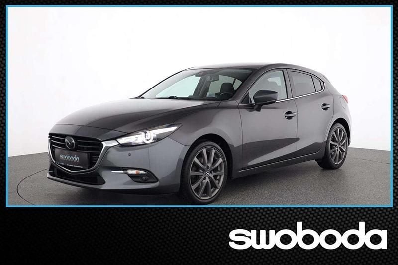 Machine grau Gebraucht 2018 Mazda 3 Inclusive Limousine | € 16.330 (Teuer) - Bild 1/4