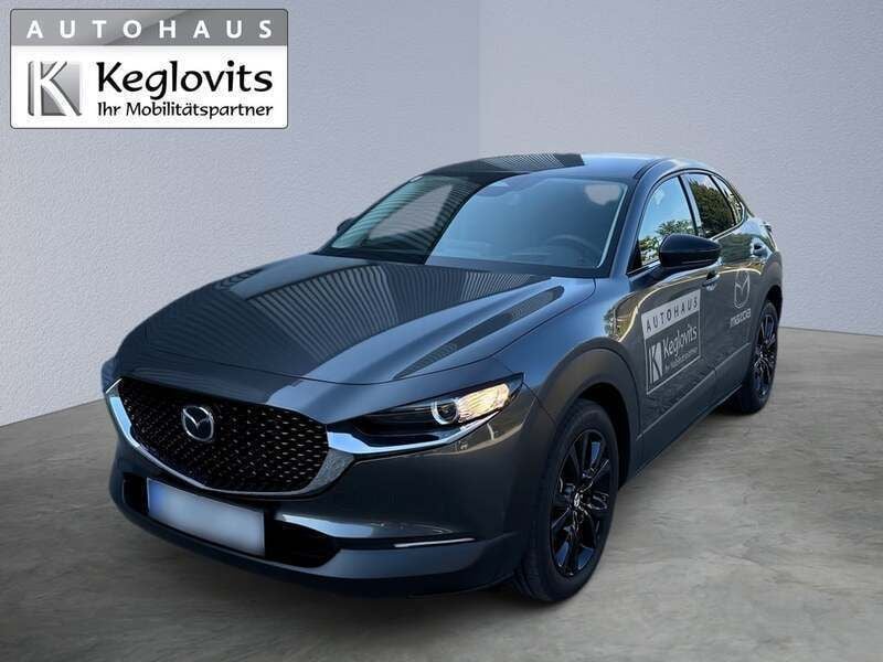 Mittelgrau normal Neu 2025 Mazda CX-30 Homura-Line SUV | € 30.690 (Fairer Preis) - Bild 1/4