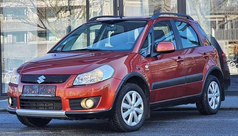 Orange Gebraucht 2009 Suzuki SX4 GL SUV | € 4.590 - Bild 1/4