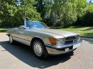 Silber Gebraucht 1989 Mercedes SL420 Cabrio | € 56.916 - Bild 1/4