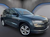 gebraucht Skoda Karoq 15 TSI Sportline DSG *AHK*Kamera*Keyless*Virtual*