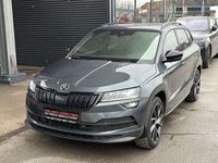 gebraucht Skoda Karoq 2,0 TDI SCR 4x4 Sportline DSG / AHK / STHZ / PA...