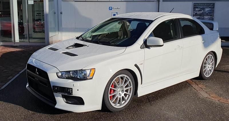 Weiss Gebraucht 2015 Mitsubishi Lancer Limousine | CHF 36’800 (Fairer Preis) - Bild 1/4