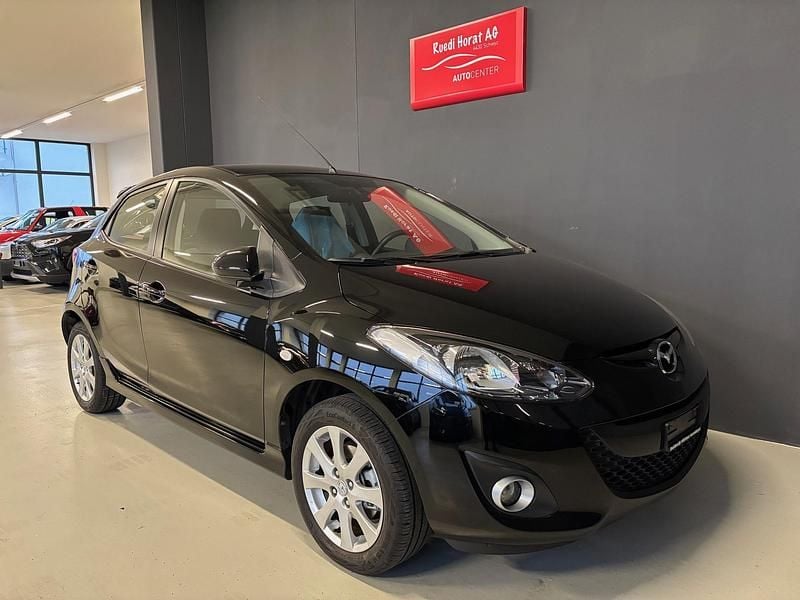 Schwarz Gebraucht 2011 Mazda 2 Exclusive Limousine | CHF 7’900 - Bild 1/4