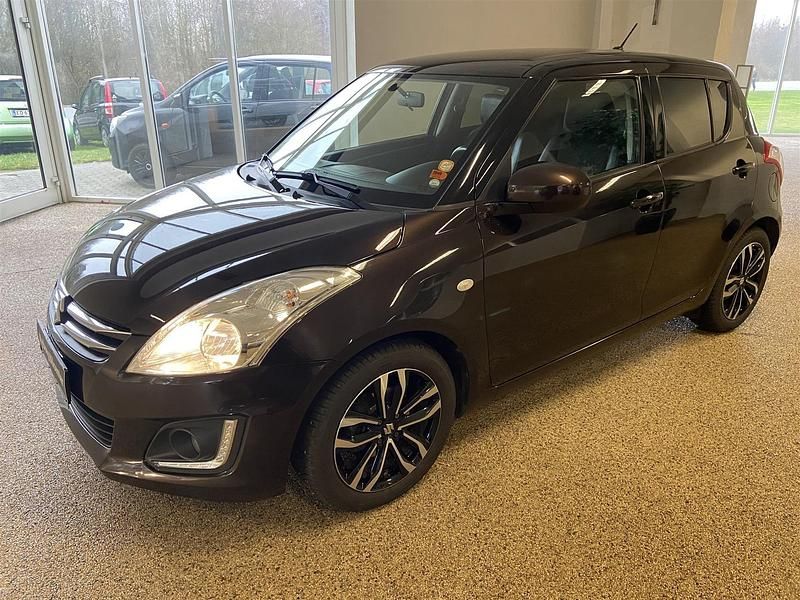 Brunmetal Brugt 2015 Suzuki Swift Style Hatchback | 64.900 kr. (Fair pris) - Billede 1/4