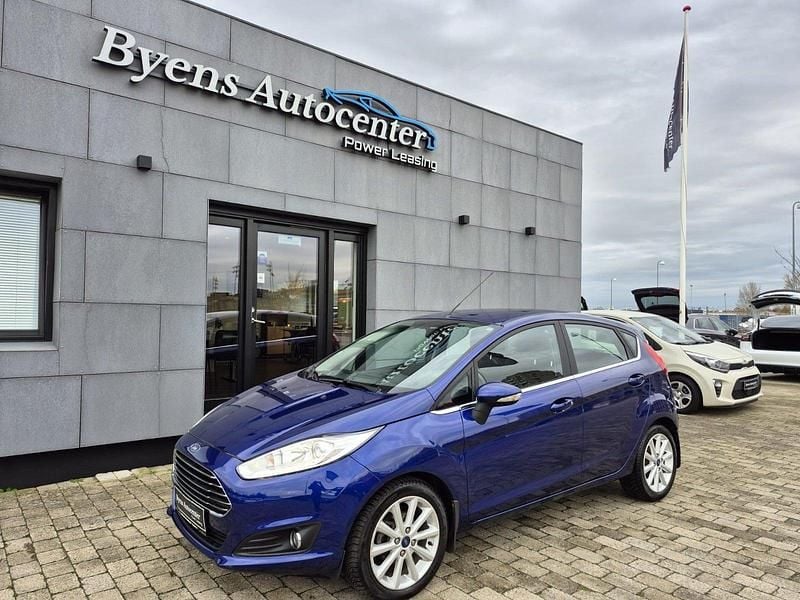 Blåmetal Brugt 2016 Ford Fiesta Titanium Hatchback | 78.500 kr. (Lidt for dyr) - Billede 1/4