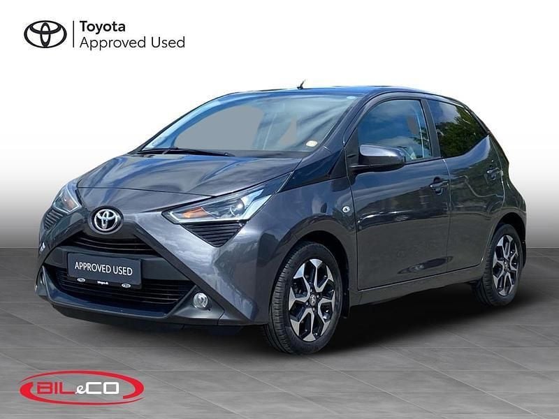 1g3 ash grey Brugt 2021 Toyota Aygo x-press Hatchback | 99.900 kr. (Fair pris) - Billede 1/4