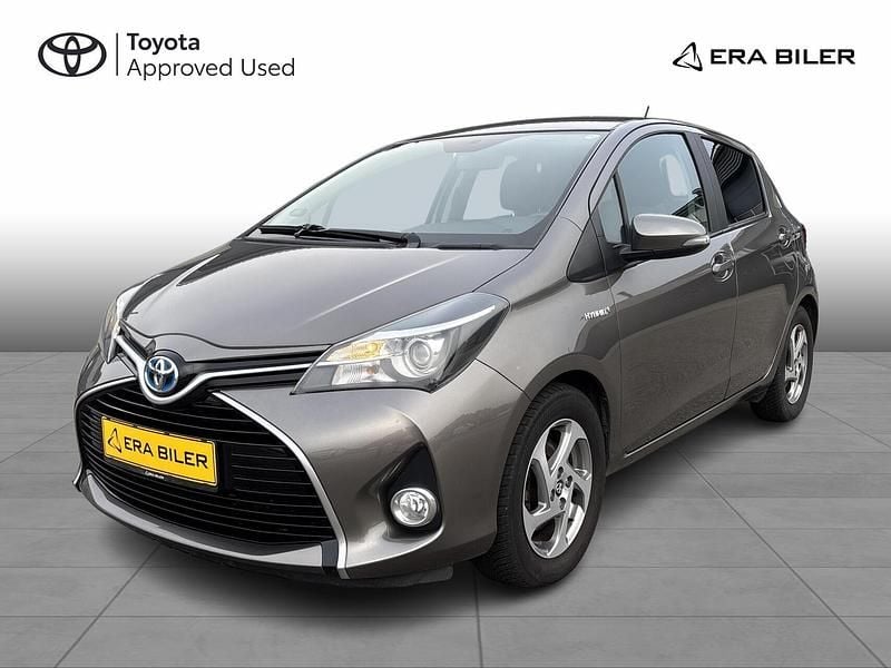 Platinum bronze Brugt 2016 Toyota Yaris Hybrid H2 Hatchback | 59.900 kr. - Billede 1/4