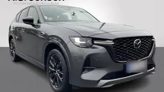 Farve ……………………………………………………………………. machine grey Ny 2025 Mazda CX-60 Homura-Line SUV | 519.900 kr. (Fair pris)