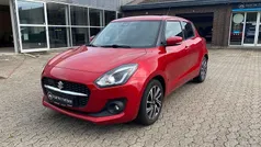 Rødmetal Brugt 2021 Suzuki Swift Exclusive Hatchback | 149.900 kr. (Fair pris)