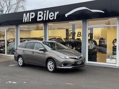 Bronzemetal Brugt 2019 Toyota Auris Hybrid Comfort Stationcar | 134.900 kr. (Fair pris)