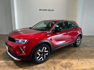 Cosmos red metallic Brugt 2023 Opel Mokka-e Elegance SUV | 144.990 kr. (Fair pris)