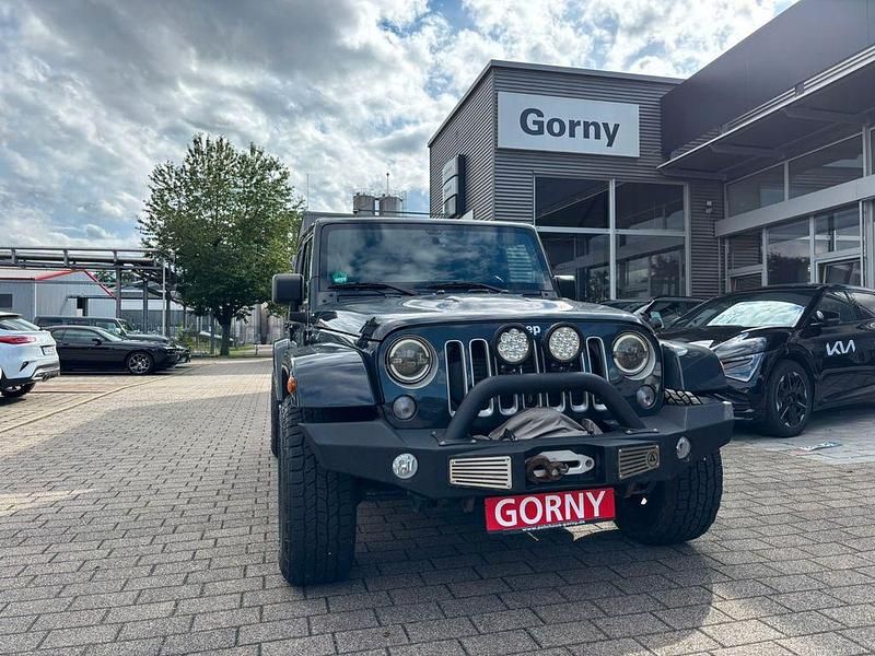Grau Gebraucht 2018 Jeep Wrangler Unlimited Sahara SUV | 38.790 € (Teuer) - Bild 1/4