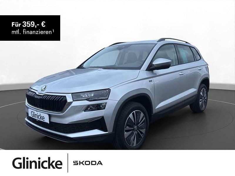 Brilliantsilber metallic Gebraucht 2024 Skoda Karoq Drive SUV | 33.990 € (Fairer Preis) - Bild 1/3