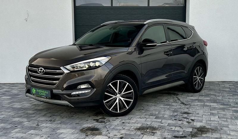 Braun Gebraucht 2018 Hyundai Tucson Passion Plus SUV | 18.790 € (Fairer Preis) - Bild 1/4