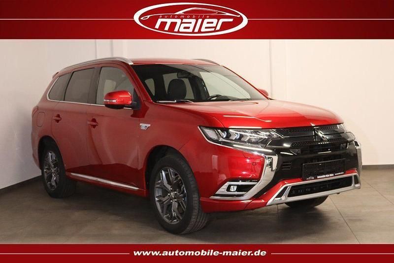 Dynamik rot (d) Gebraucht 2021 Mitsubishi Outlander P-HEV Plus SUV | 20.900 € (Guter Preis) - Bild 1/4