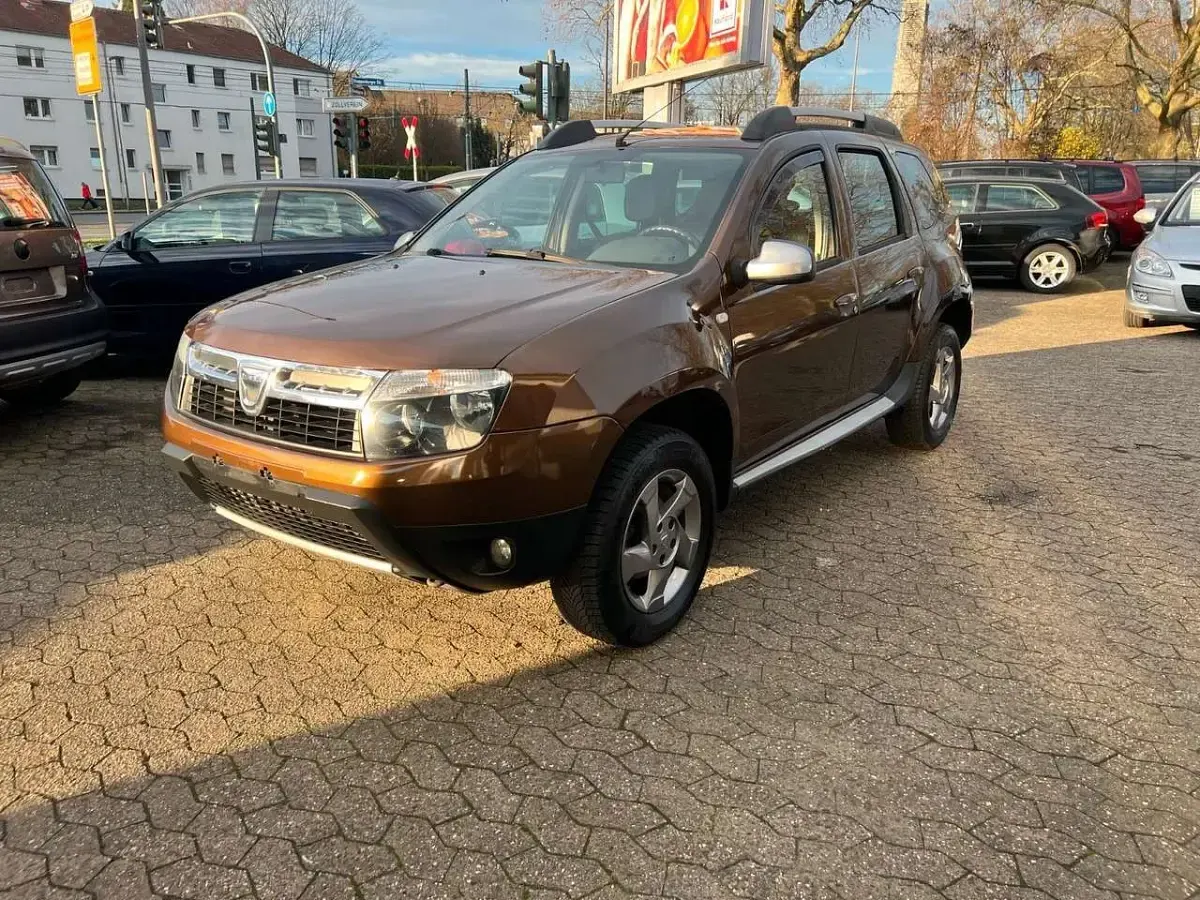 Używany Dacia Duster Prestige 105 KM (77 kW) 2012 Brązowy Minivan