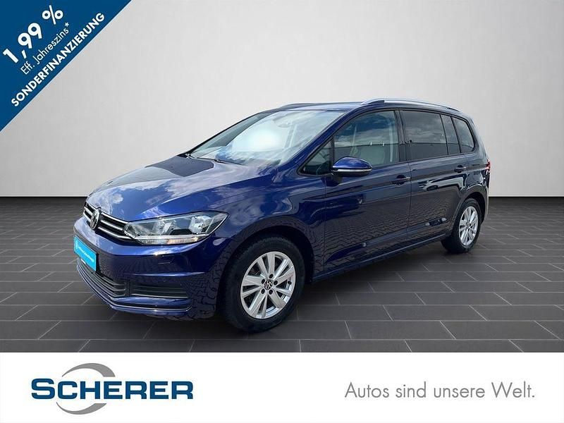 Blau Gebraucht 2024 VW Touran Comfortline Van / Kleinbus | 32.480 € (Fairer Preis) - Bild 1/4