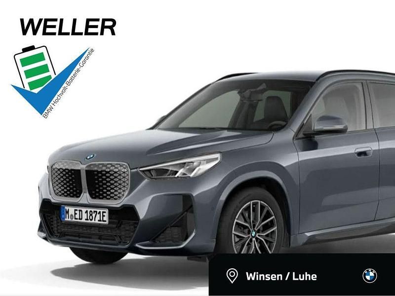 Storm bay (grau) Neu 2025 BMW iX1 Comfort Edition SUV | 62.468 € (Teuer) - Bild 1/4
