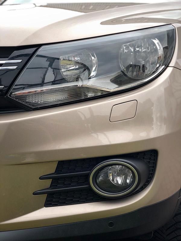 Gelb Gebraucht 2014 VW Tiguan SUV | 10.390 € (Superpreis) - Bild 1/4