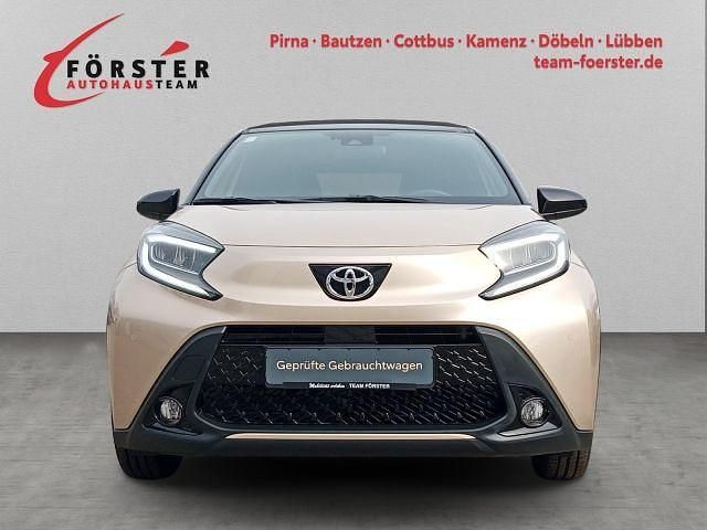 Gebraucht Toyota Aygo X Style 72 PS (52 kW) 2022 Ginger beige metallic/ night sky black SUV