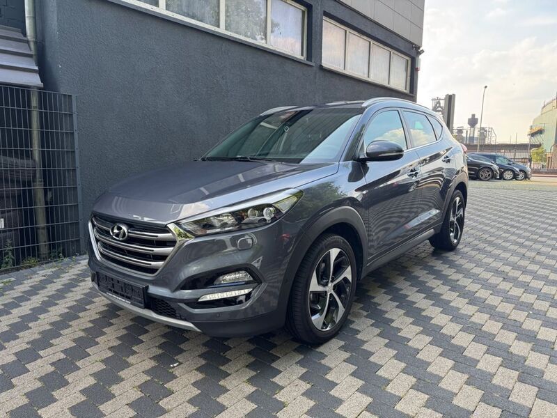 Grau Gebraucht 2017 Hyundai Tucson Premium SUV | 18.800 € (Fairer Preis) - Bild 1/4