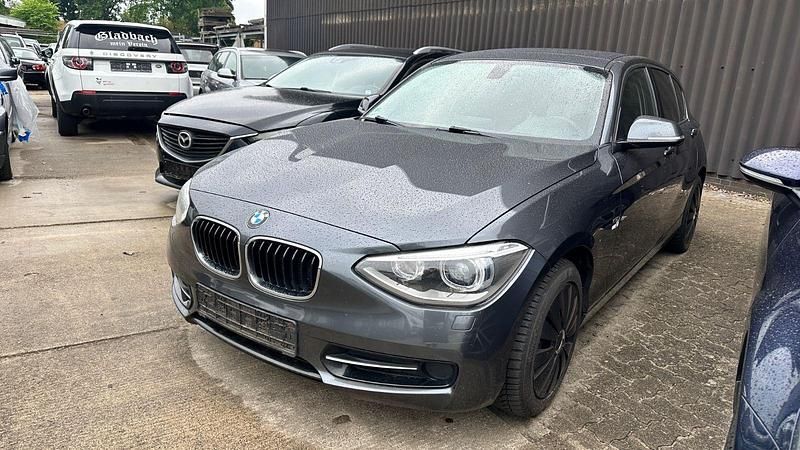 Grau Gebraucht 2014 BMW 114 Sport Line Kleinwagen | 5.999 € (Guter Preis) - Bild 1/4