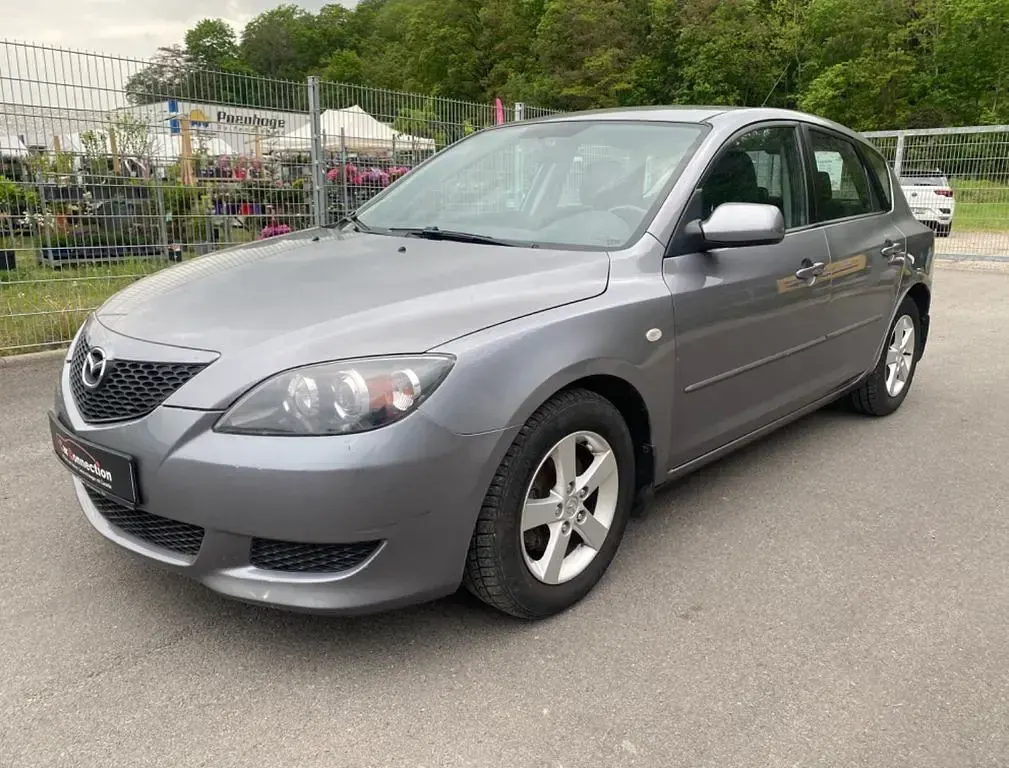 Używany Mazda 3 Comfort 105 KM (77 kW) 2004 Szary Sedan/Limuzyna