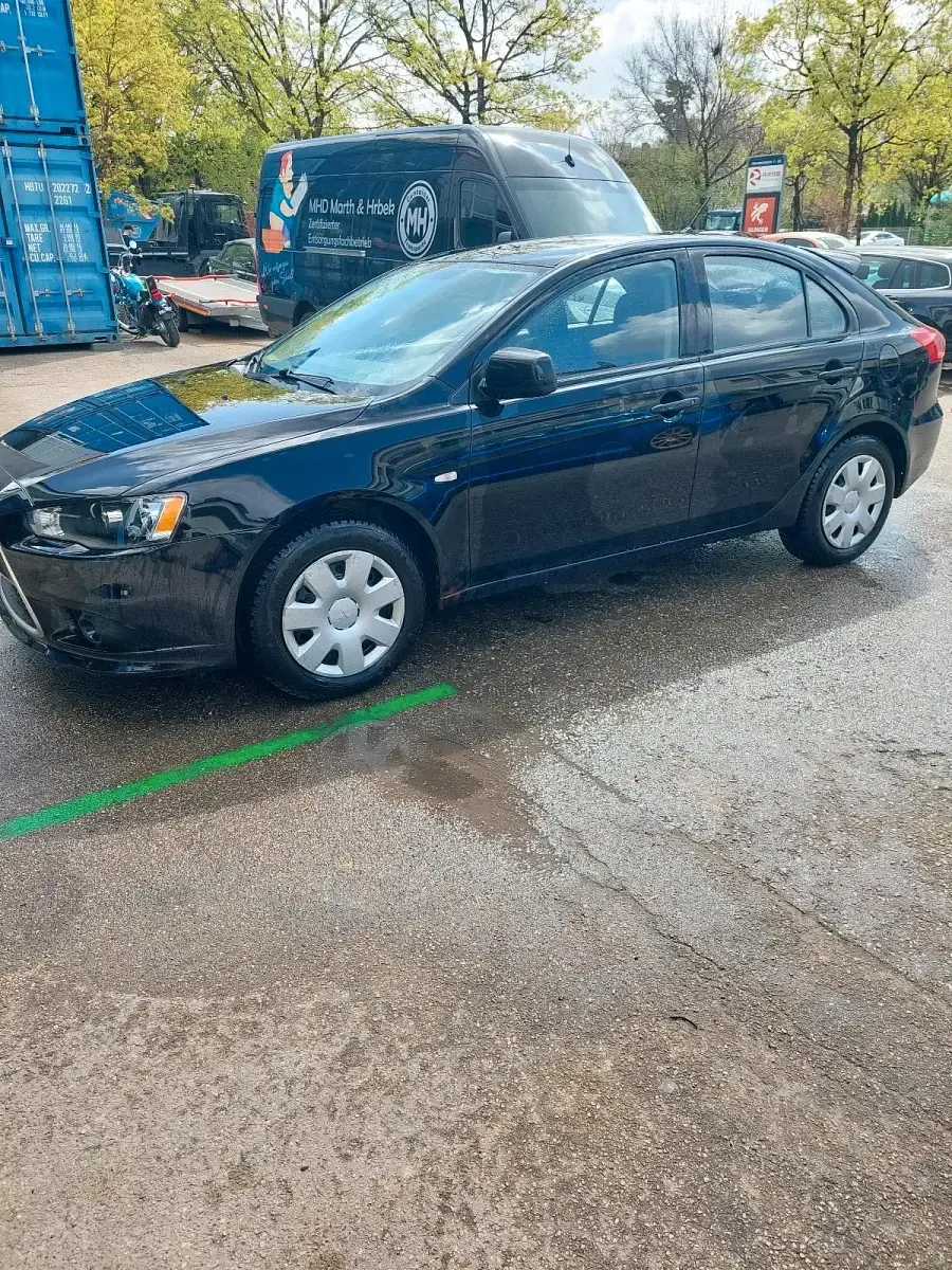 Second-hand Mitsubishi Lancer 109 CP (80 kW) 2010 Negru Berlinǎ