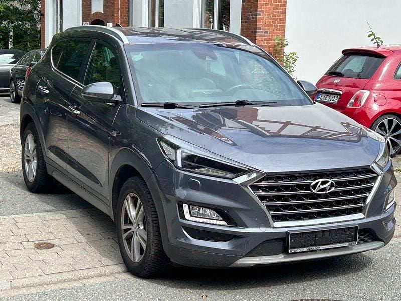 Grau Gebraucht 2019 Hyundai Tucson Premium SUV | 17.999 € (Superpreis) - Bild 1/4