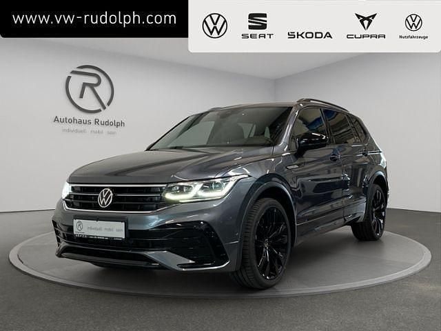 Platinum grey metallic (metallic) Gebraucht 2022 VW Tiguan Allspace R-line SUV | 34.879 € (Fairer Preis) - Bild 1/4