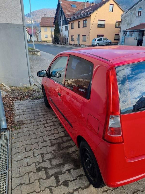 Gebraucht Daihatsu Cuore 58 PS (42 kW) 2005 Rot Kleinwagen