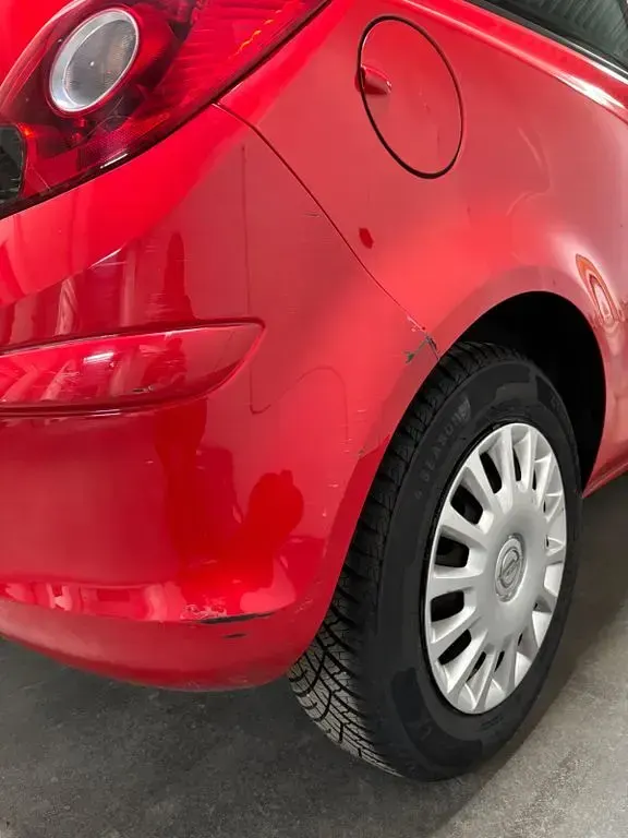 Używany Opel Corsa Edition 60 KM (44 kW) 2010 Czerwony Hatchback