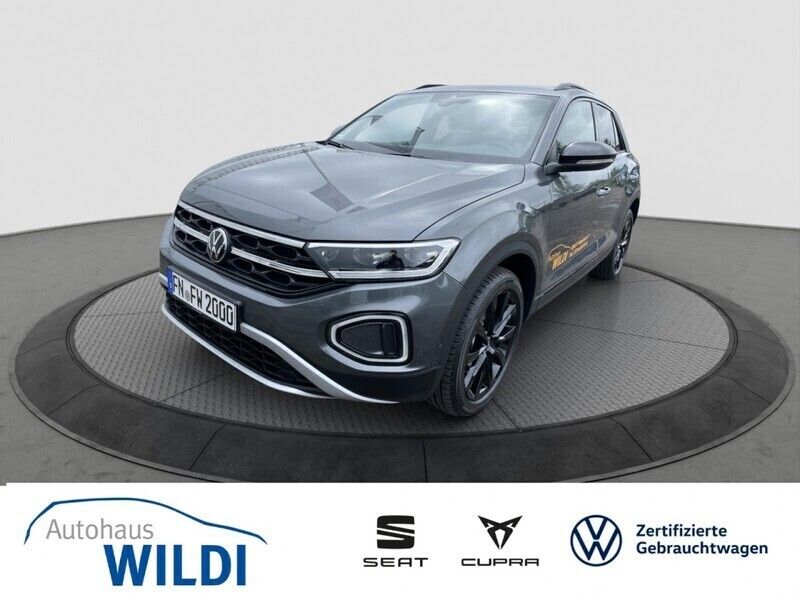 Indiumgrau Gebraucht 2024 VW T-Roc Style SUV | 35.430 € (Teuer) - Bild 1/4