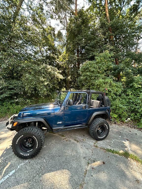 Blau Gebraucht 2003 Jeep Wrangler Sahara SUV | 23.500 € (Teuer) - Bild 1/4