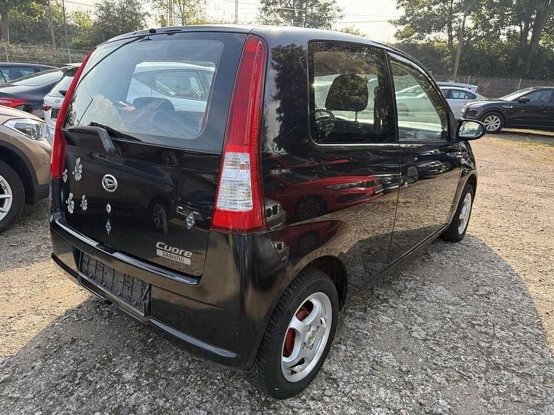 Gebraucht Daihatsu Cuore 58 PS (42 kW) 2006 Schwarz Kleinwagen