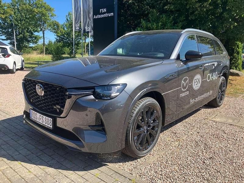 Machine gray Neu 2025 Mazda CX-80 Homura-Line SUV | 59.650 € (Fairer Preis) - Bild 1/4